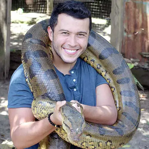 rudy miller with a green anaconda